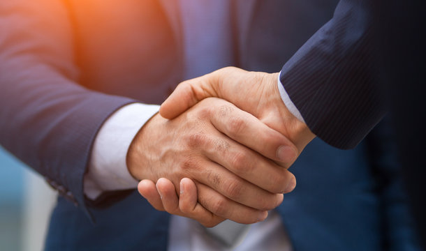 Symbolic handshake between Albemarle Corporation and Caterpillar Inc.