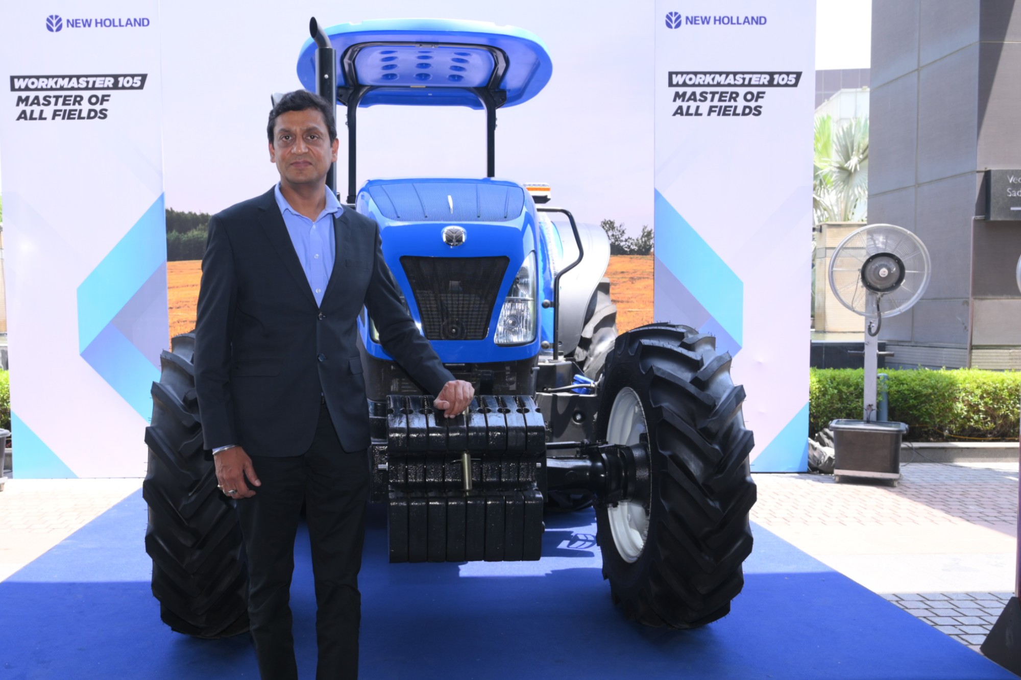 Mr. Narinder Mittal, Country Manager & Managing Director - CNH India & SAARC with the newly launched Made-in-India Workmaster 105 tractor _ B2B
